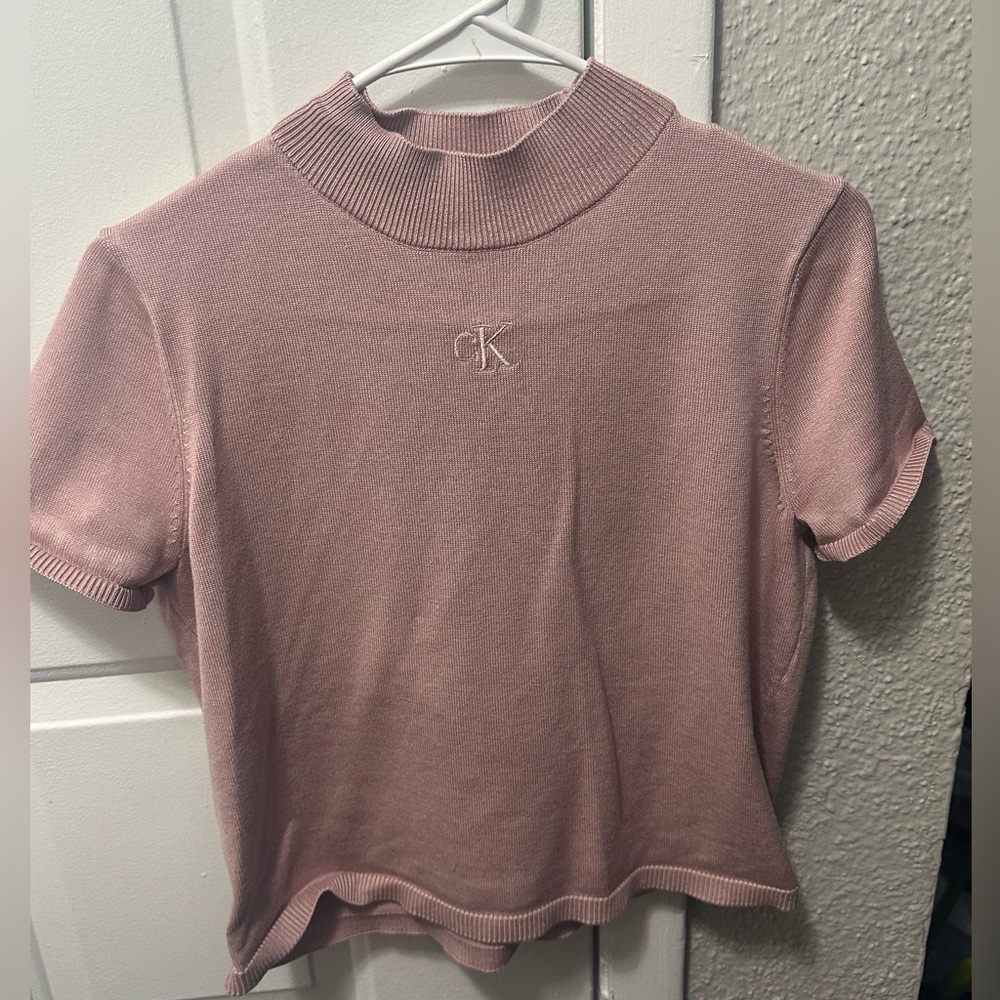 Calvin klein blush pink top size medium 
Only worn once
Great condition